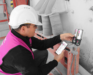 Engineer installing Simalube automatic lubricators